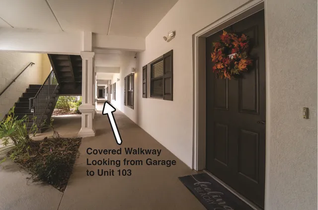 an aerial view of a house with swimming pool outdoor seating and yard