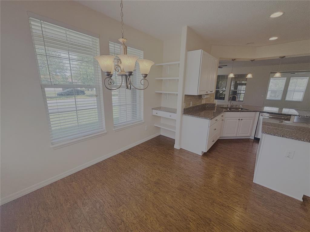 4859 Northwest 35th Ln Road Ocala, FL 34482 - Photo 12 of 30 a kitchen with stainless steel appliances granite countertop a stove and a refrigerator