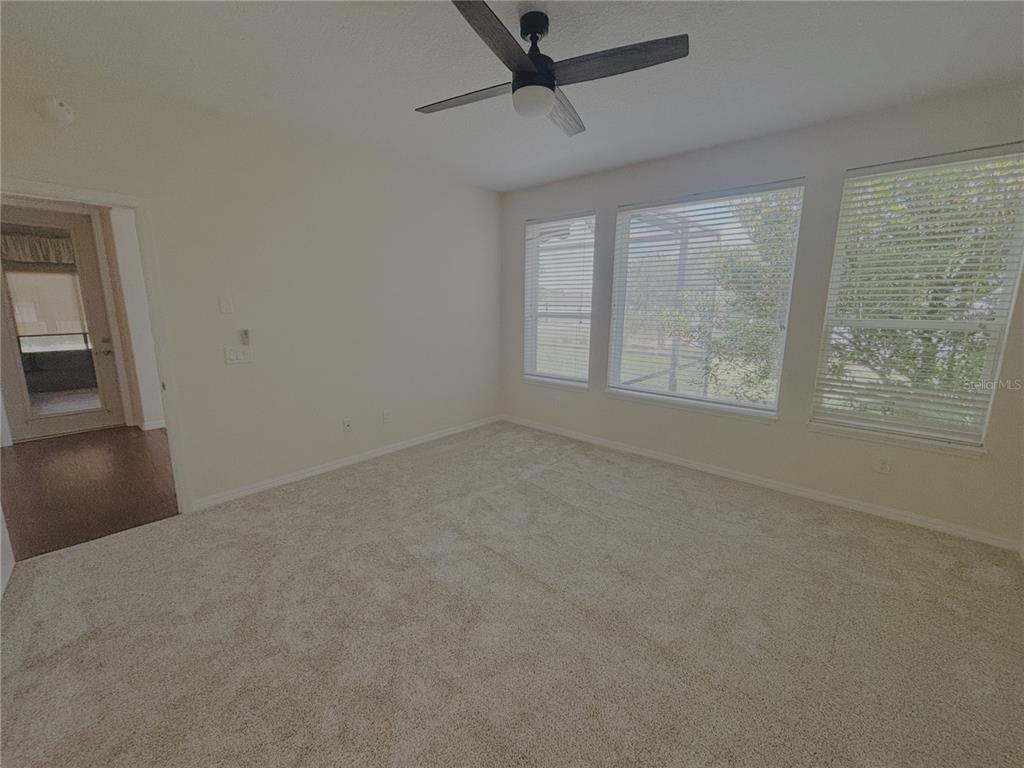 4859 Northwest 35th Ln Road Ocala, FL 34482 - Photo 16 of 30 an empty room with windows