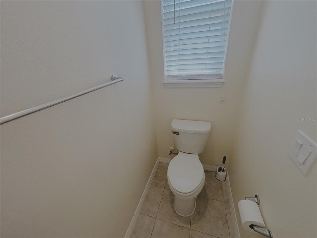 4859 Northwest 35th Ln Road Ocala, FL 34482 - Photo 19 of 30 a white toilet sitting next to a white cabinet