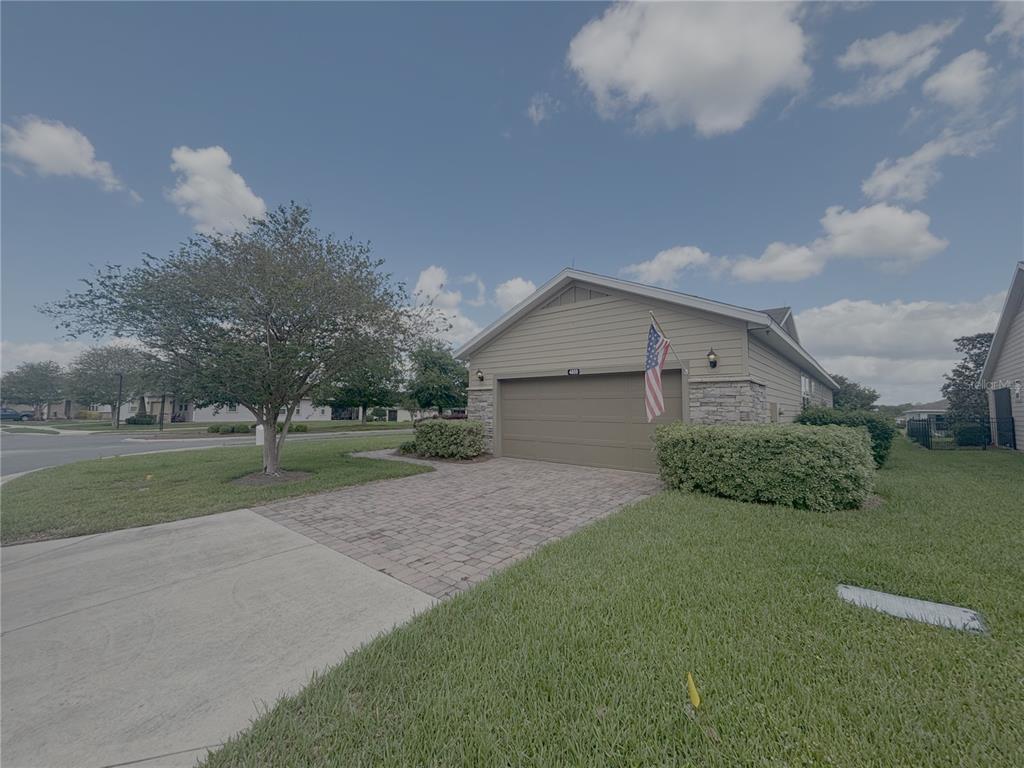 4859 Northwest 35th Ln Road Ocala, FL 34482 - Photo 2 of 30 a front view of house with yard and trees