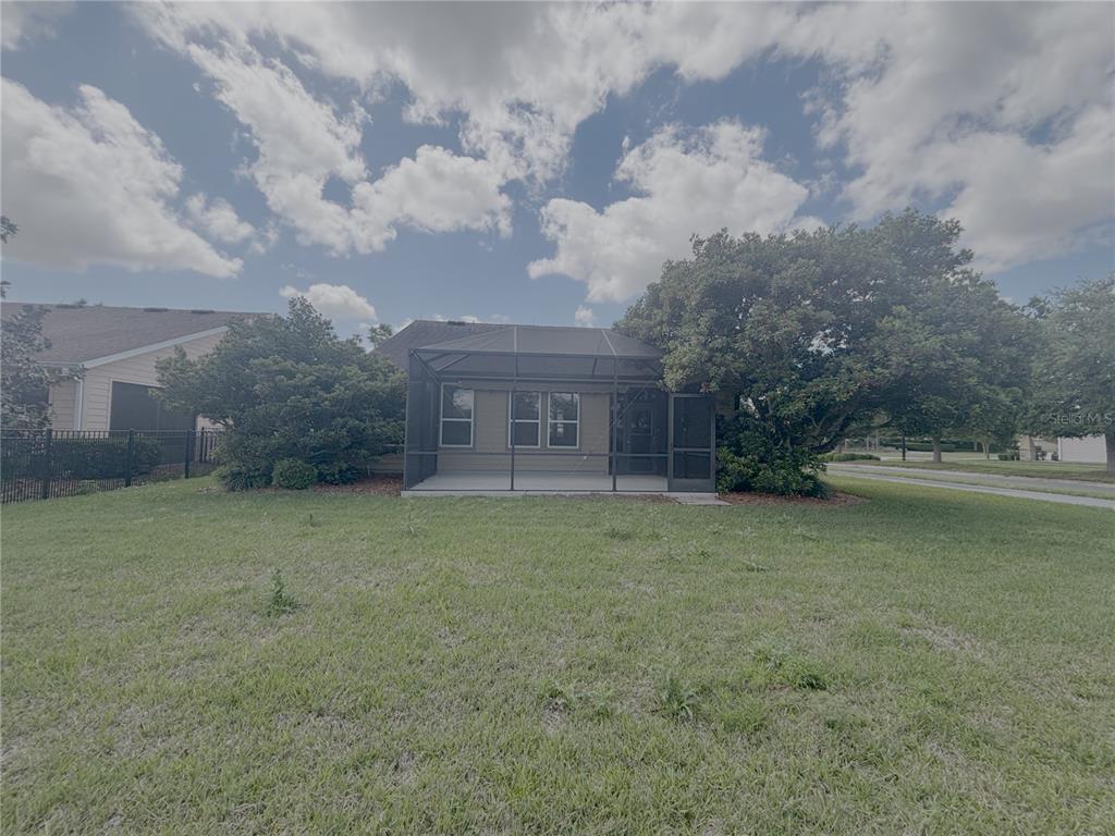 4859 Northwest 35th Ln Road Ocala, FL 34482 - Photo 30 of 30 a view of a house with a yard