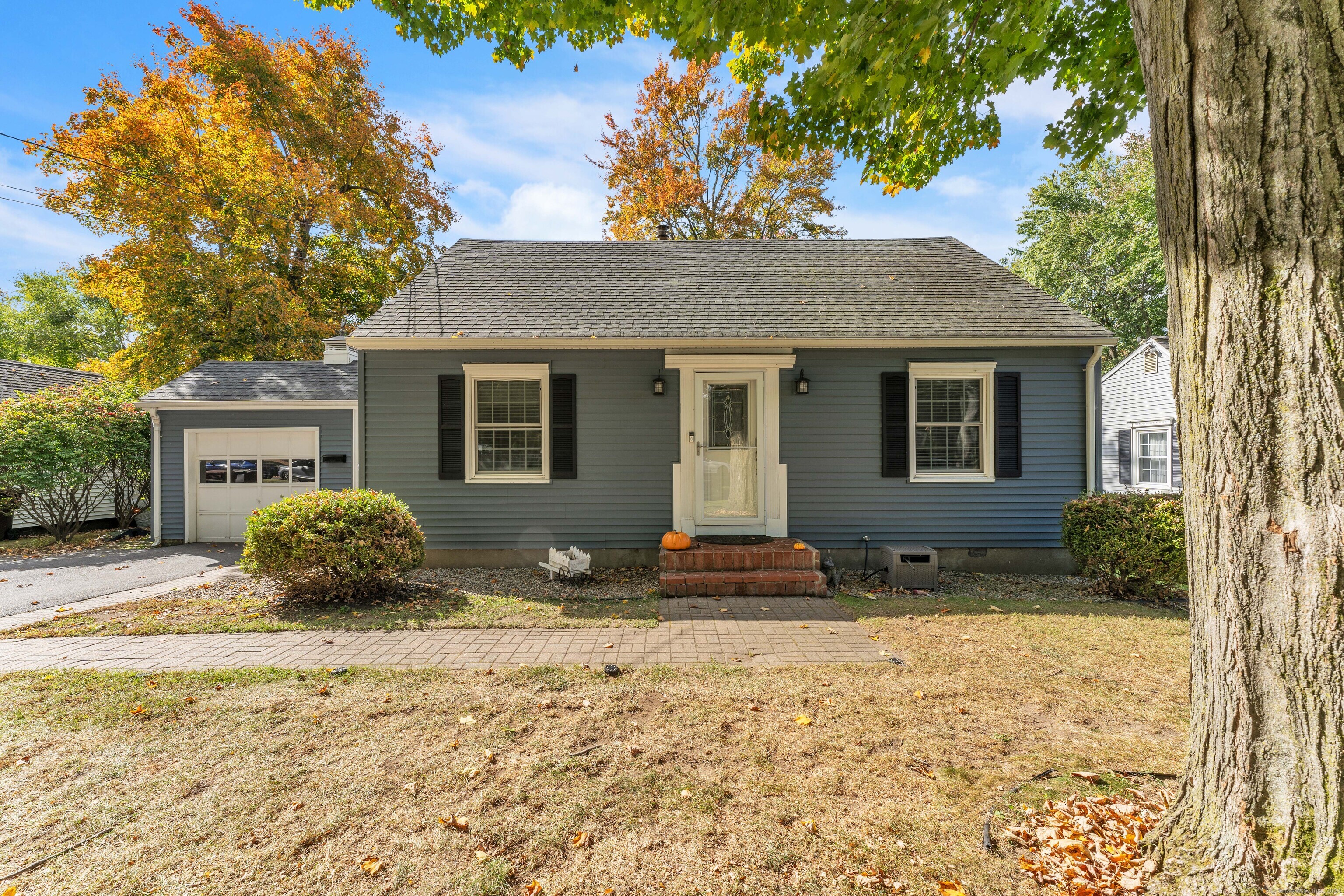 3 South George Washington Road Enfield, CT 06082 - Photo 1 of 1 a backyard of a house with potted plants and large tree