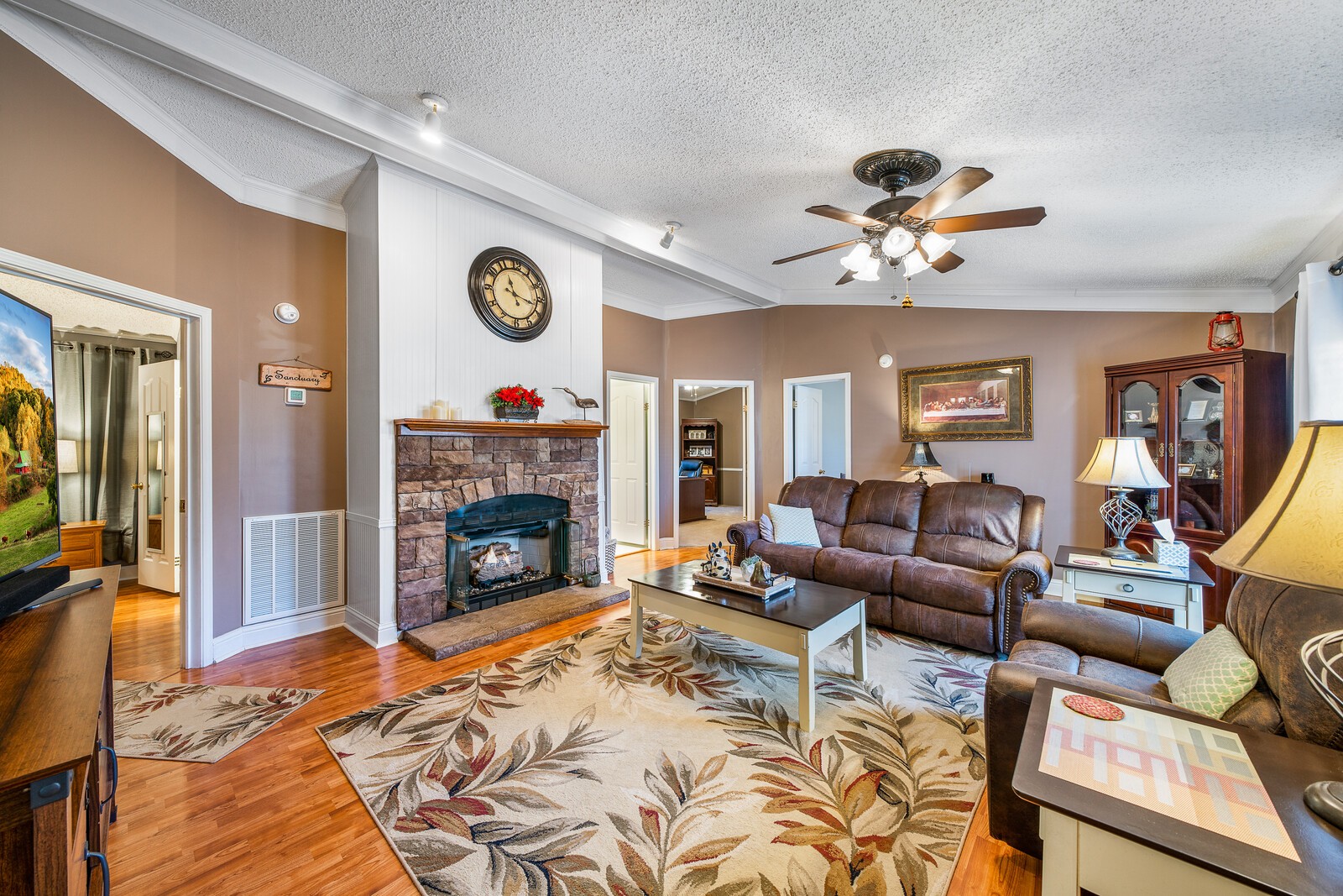 270 Allen's Chapel Road Smithville, TN 37166 - Photo 7 of 26 a living room with furniture a fireplace and a flat screen tv