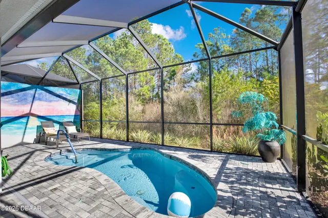 a view of a hallway with wooden floor and windows