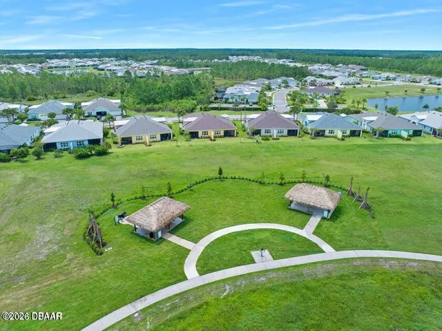 a view of a building with a cars park