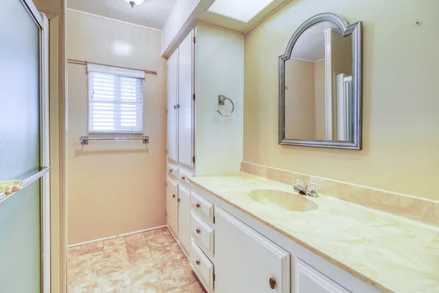 a bathroom with a sink and a mirror