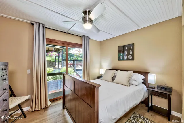 a view of balcony with two chairs and a potted plant