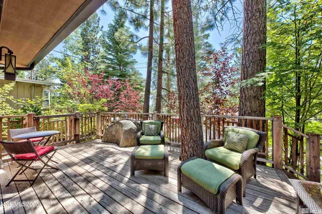 a balcony with furniture and a potted plant