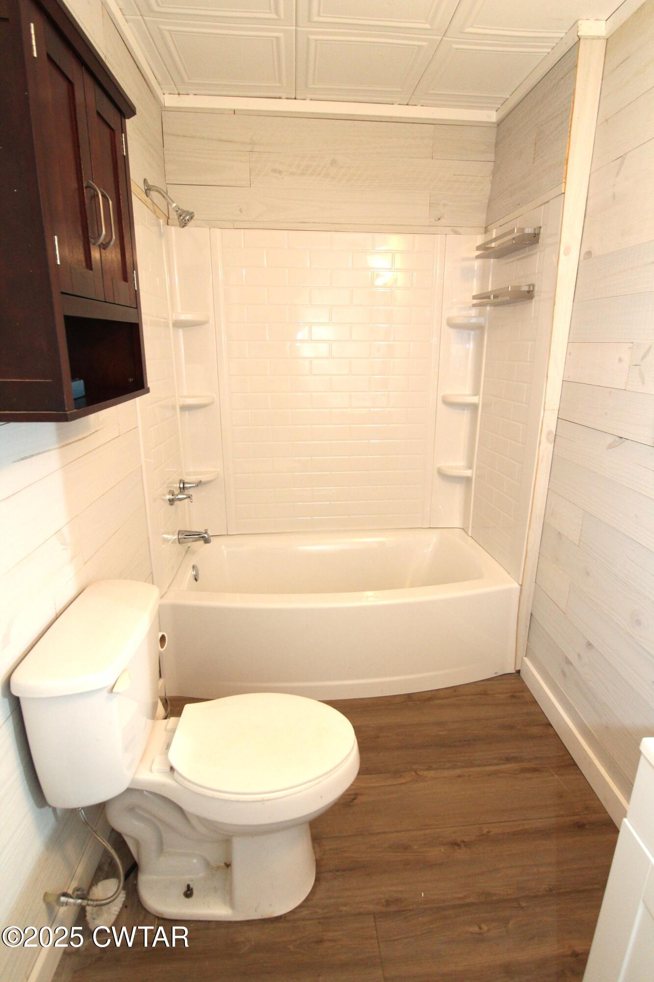 152 Hunter Jones Road Milan, TN 38358 - Photo 25 of 31 a bathroom with a toilet and a shower