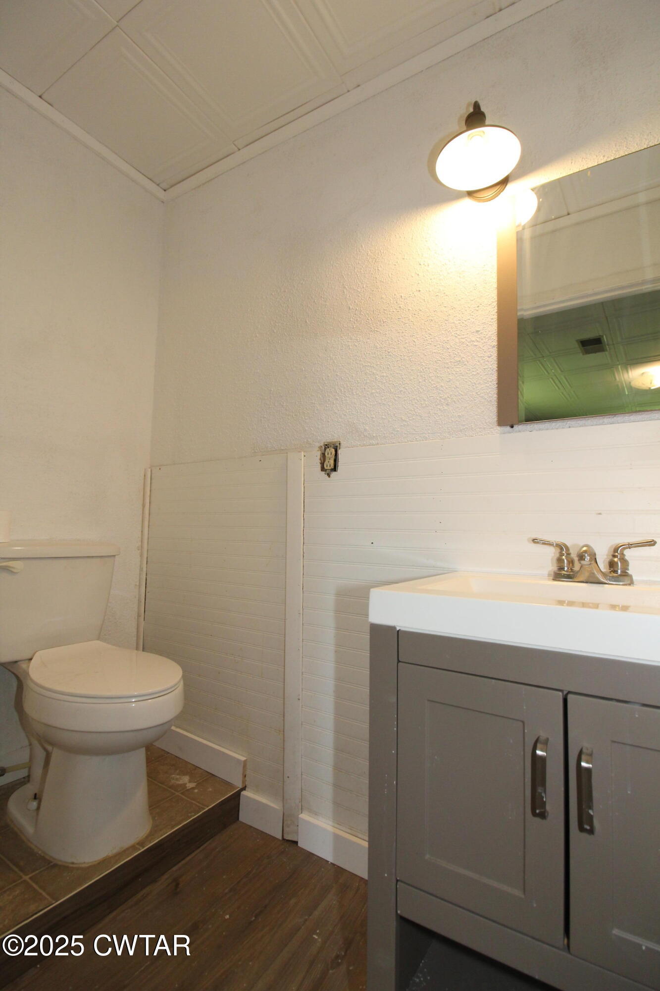 152 Hunter Jones Road Milan, TN 38358 - Photo 28 of 31 a bathroom with a sink a toilet and a mirror