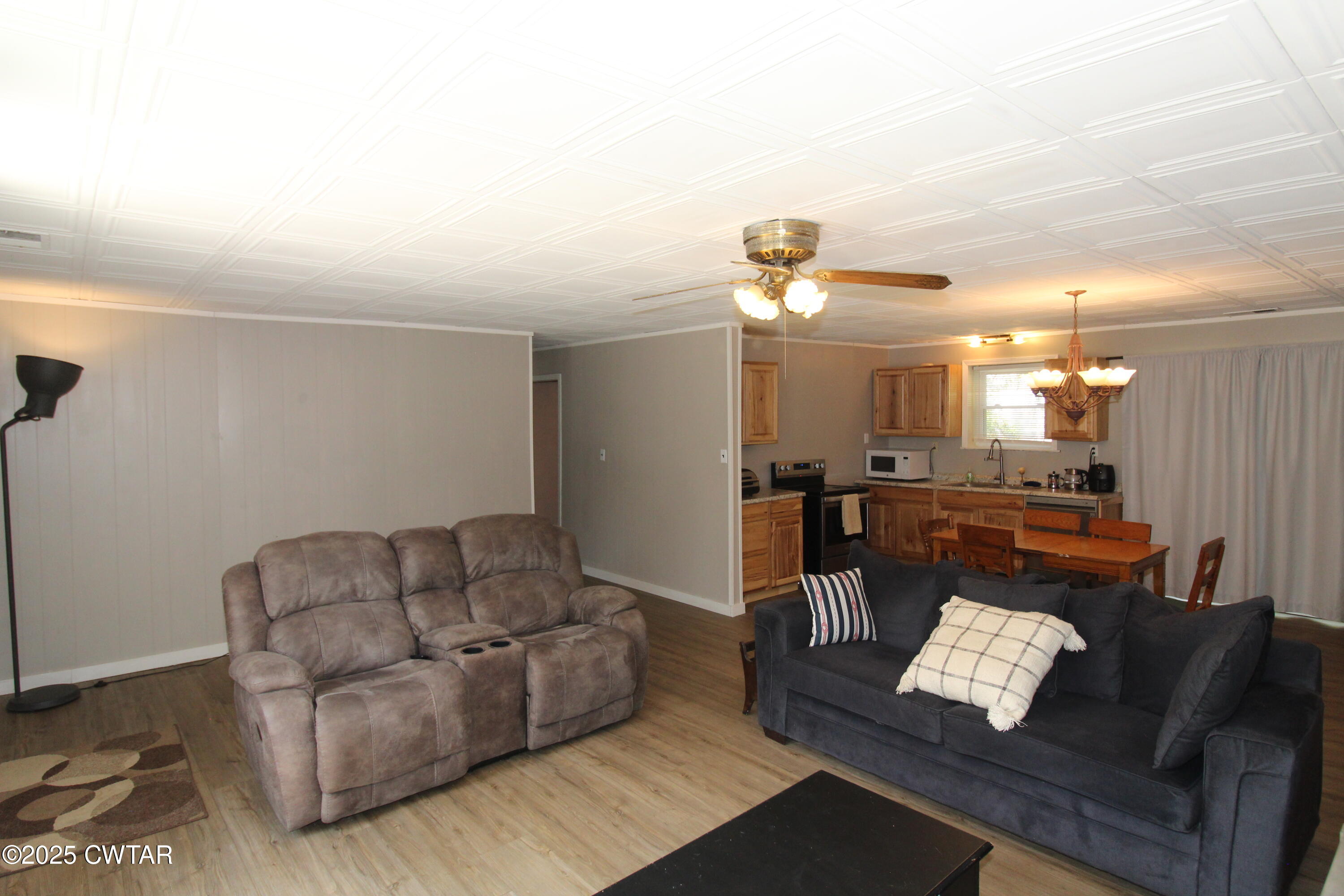 152 Hunter Jones Road Milan, TN 38358 - Photo 10 of 31 a living room with furniture and a wooden floor