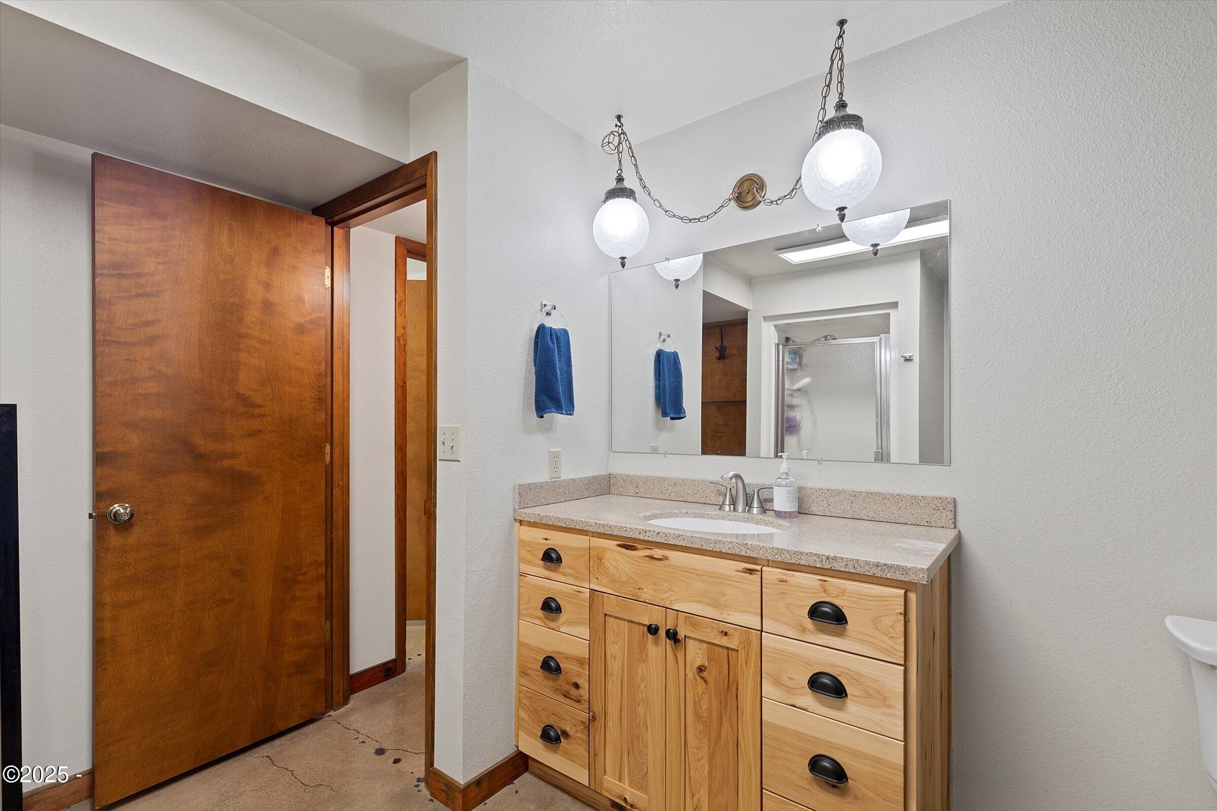 21560 Gooseneck Road Sheridan, OR 97378 - Photo 39 of 63 a bathroom with a sink and a mirror