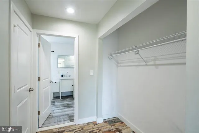 a view of a bathroom with a sink and a shower