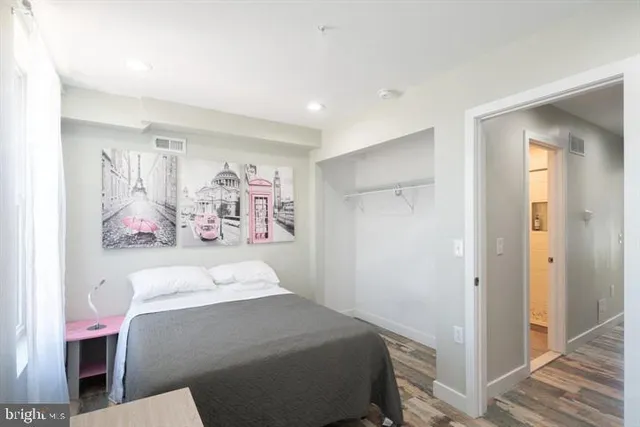 a bedroom with a bed and a view of bathroom