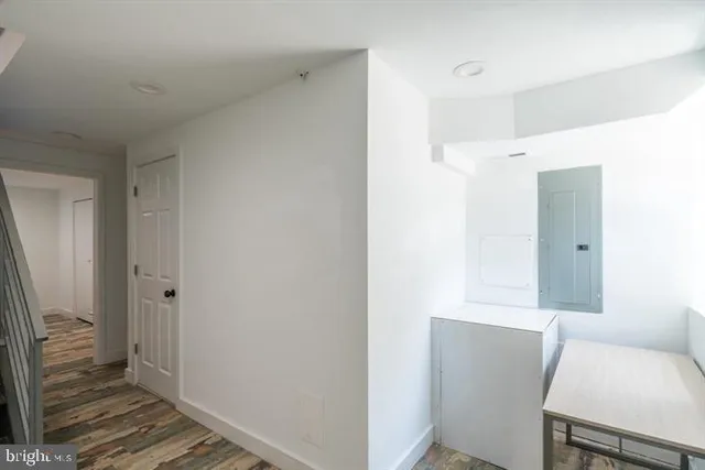 a view of room with wooden floor