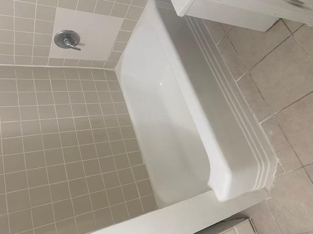 87-28 87th Street Queens, NY 11421 - Photo 13 of 15 a bathroom with a bathtub