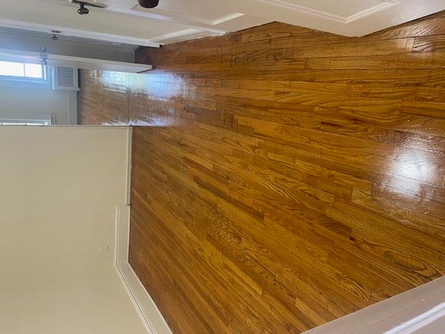 87-28 87th Street Queens, NY 11421 - Photo 7 of 15 a view of empty room with wooden floor