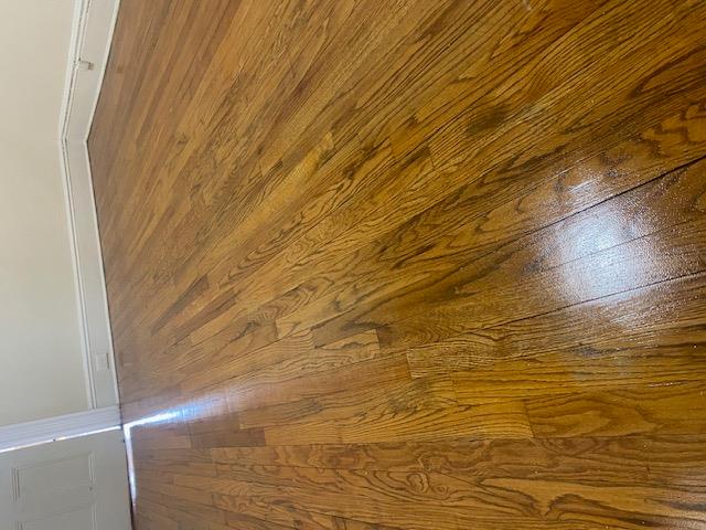 87-28 87th Street Queens, NY 11421 - Photo 8 of 15 a view of wooden floor and brick walls