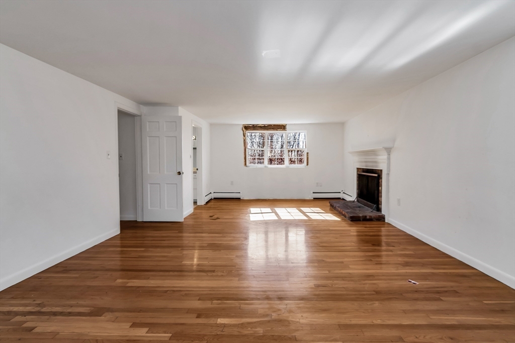 955 Hale Street Beverly, MA 01915 - Photo 11 of 32 a view of empty room with wooden floor