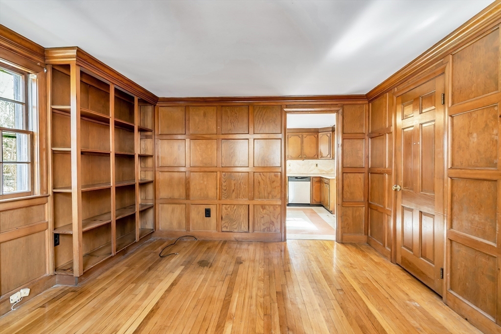 955 Hale Street Beverly, MA 01915 - Photo 12 of 32 a view of empty room with wooden floor and windows