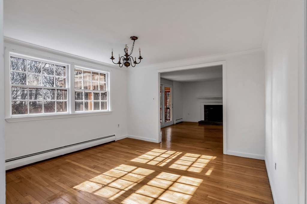 955 Hale Street Beverly, MA 01915 - Photo 17 of 32 a view of empty room with wooden floor and fan