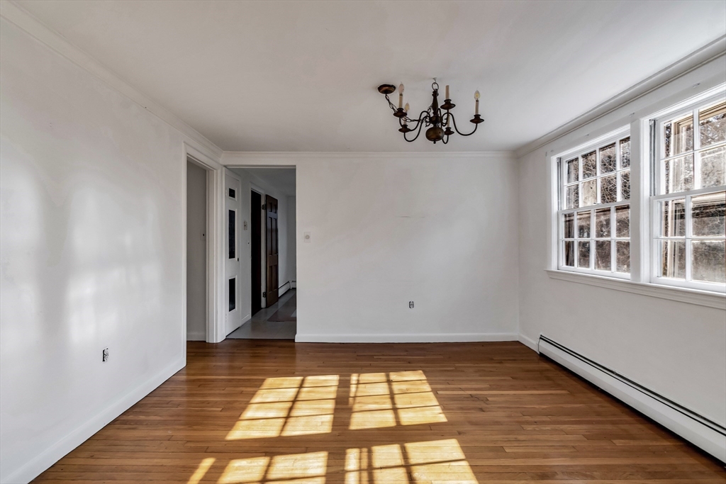 955 Hale Street Beverly, MA 01915 - Photo 18 of 32 a view of a room with wooden floor and windows