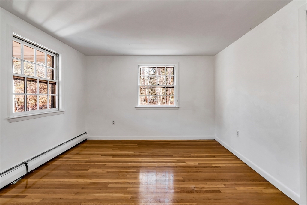 955 Hale Street Beverly, MA 01915 - Photo 20 of 32 a view of empty room with wooden floor and fan