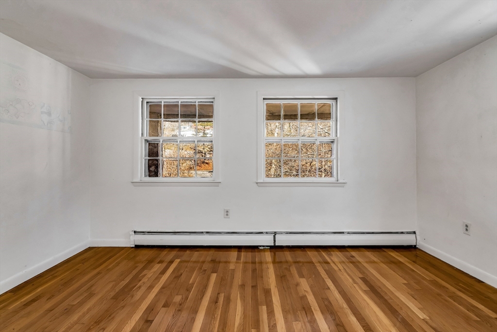 955 Hale Street Beverly, MA 01915 - Photo 21 of 32 a view of a room with wooden floor and windows