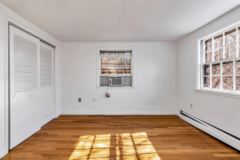 955 Hale Street Beverly, MA 01915 - Photo 23 of 32 a view of a room with wooden floor and window