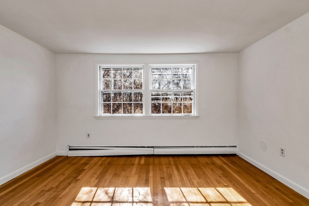 955 Hale Street Beverly, MA 01915 - Photo 24 of 32 a view of a room with rack on the wall and a window