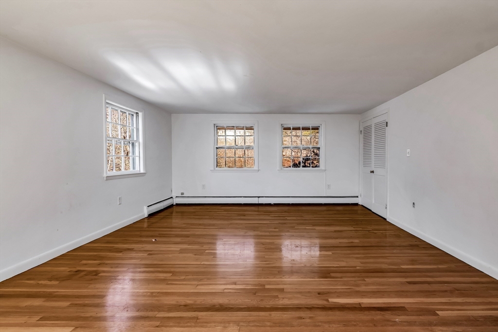 955 Hale Street Beverly, MA 01915 - Photo 27 of 32 a view of a room with window and wooden floor