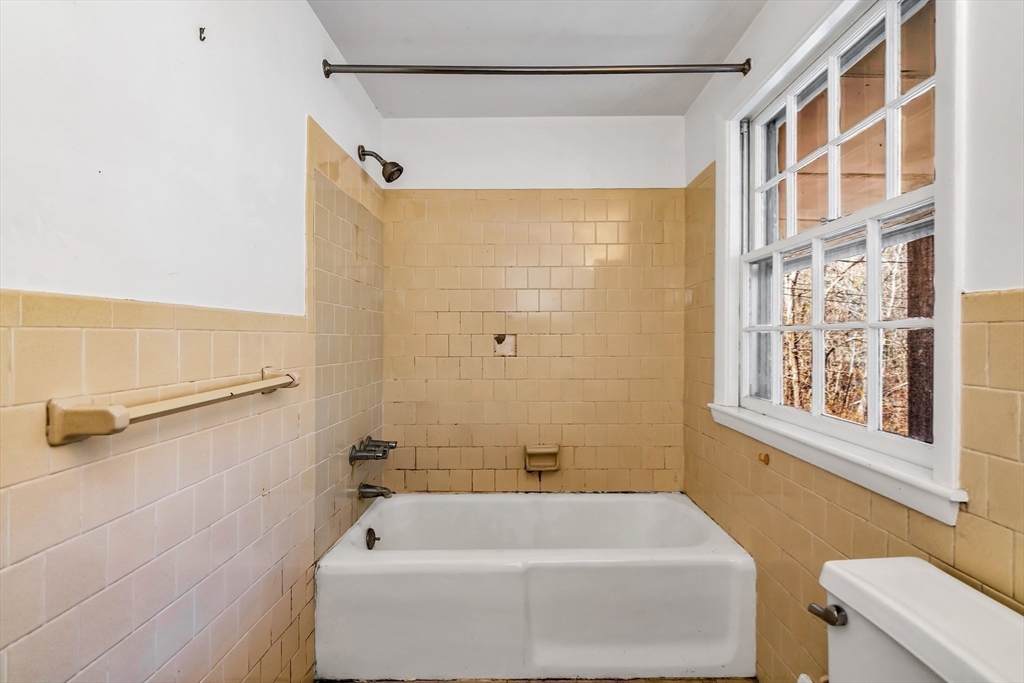 955 Hale Street Beverly, MA 01915 - Photo 30 of 32 a bathroom with a bathtub and a shower
