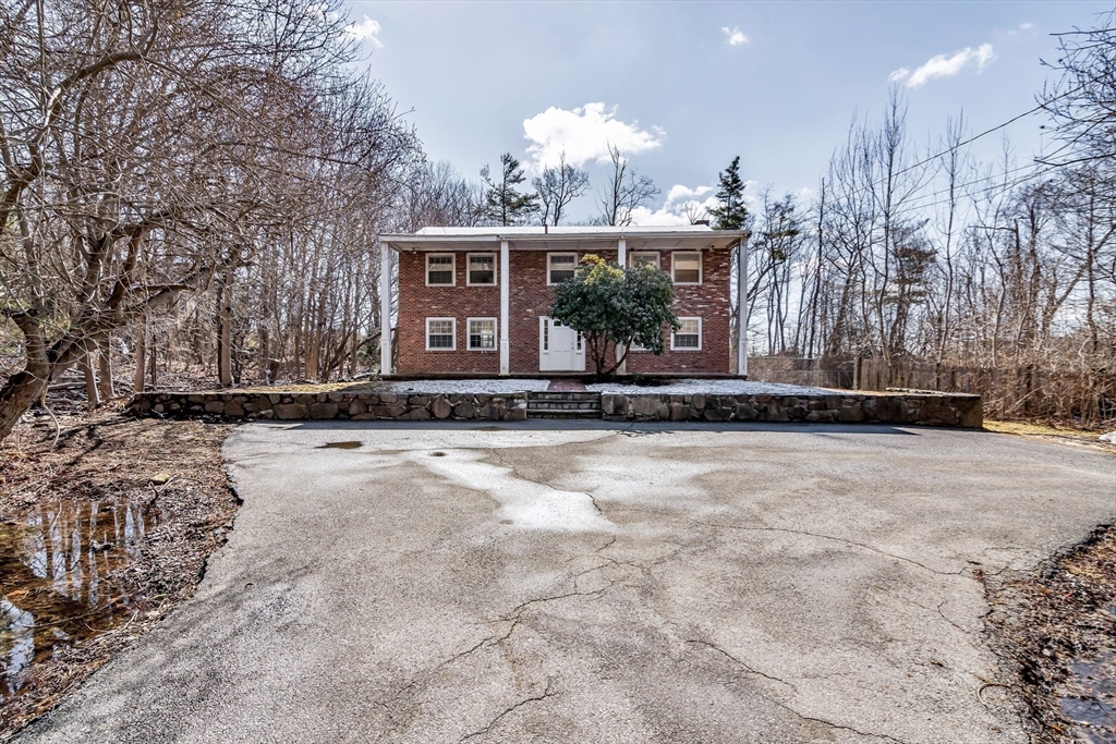 955 Hale Street Beverly, MA 01915 - Photo 3 of 32 a view of a house with a yard and potted plants