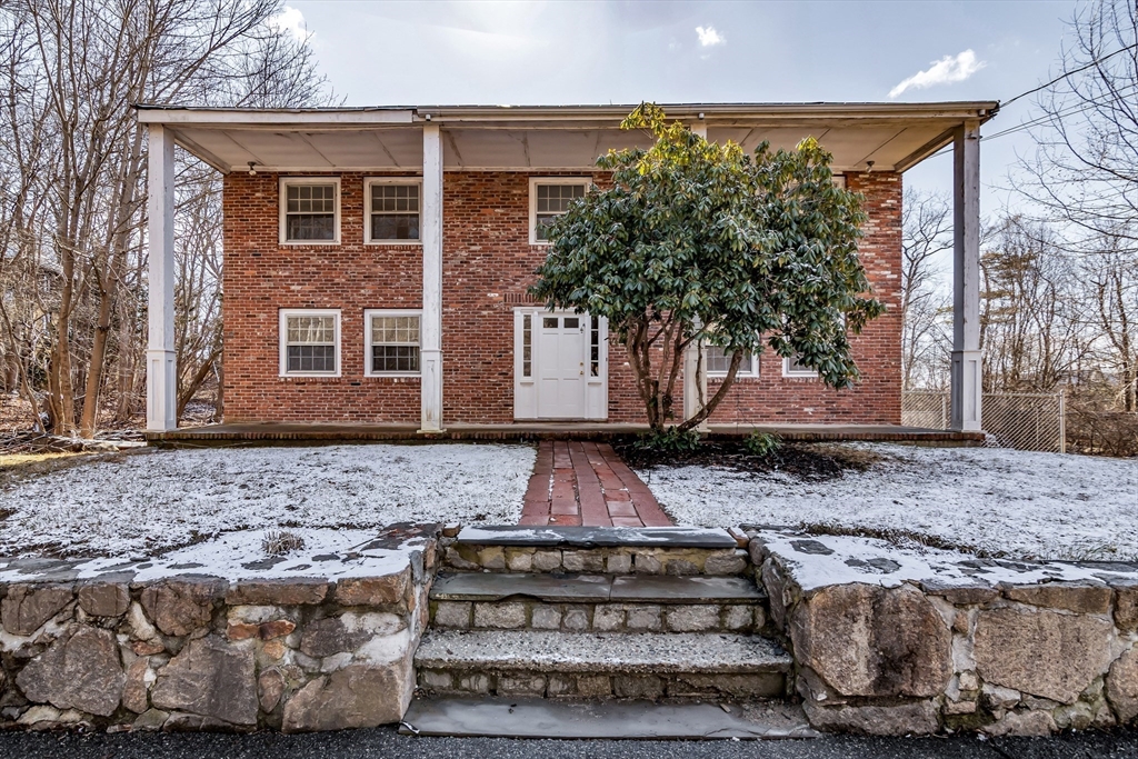 955 Hale Street Beverly, MA 01915 - Photo 4 of 32 a front view of a house with a garden