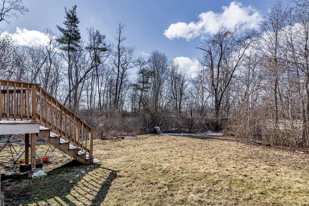 955 Hale Street Beverly, MA 01915 - Photo 7 of 32 a view of a house with a yard