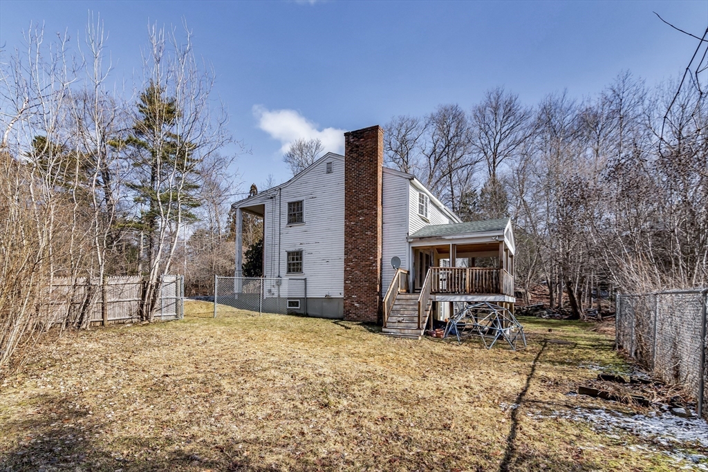 955 Hale Street Beverly, MA 01915 - Photo 8 of 32 a view of a house with a yard covered in snow