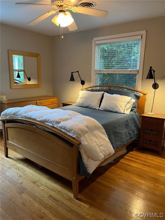7508 Marilea Road Richmond, VA 23225 - Photo 18 of 30 Primary Bedroom with Hardwood Floors, Ceiling Fan with light and double closet with storage above