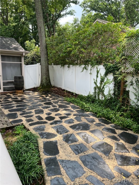 7508 Marilea Road Richmond, VA 23225 - Photo 25 of 30 The side slate patio leads to the screened porch and kitchen access