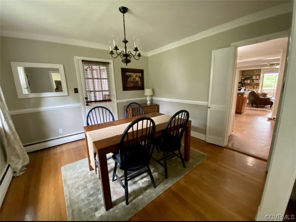 7508 Marilea Road Richmond, VA 23225 - Photo 8 of 30 Formal Dining Room with nice moldings, chandelier, access to screened porch and kitchen/family room