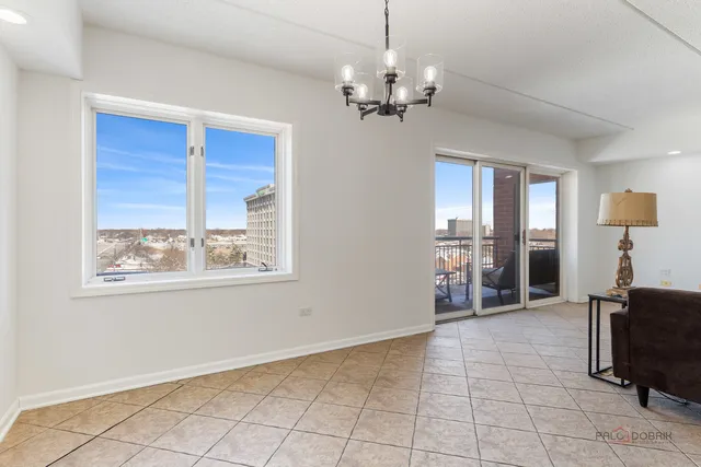 a view of a livingroom with furniture window and wooden floor