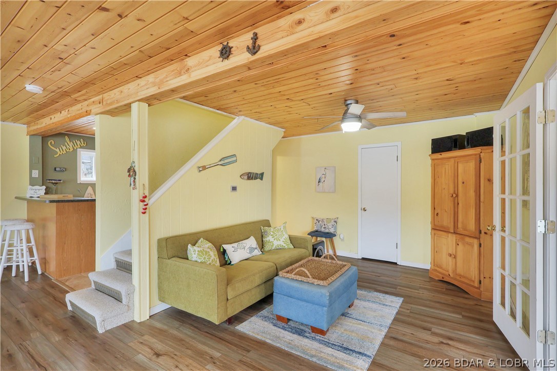 29966 Oak Knoll Road Rocky Mount, MO 65072 - Photo 13 of 68 The living room does not end there. This warm, rus