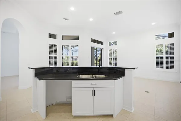 a kitchen with sink cabinets and window