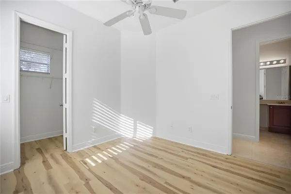 a view of a room with wooden floor and staircase