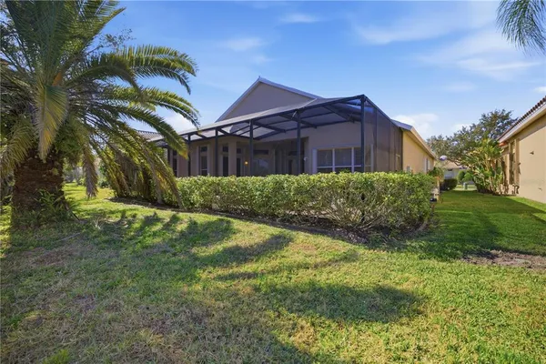 a view of a big yard in front of a house