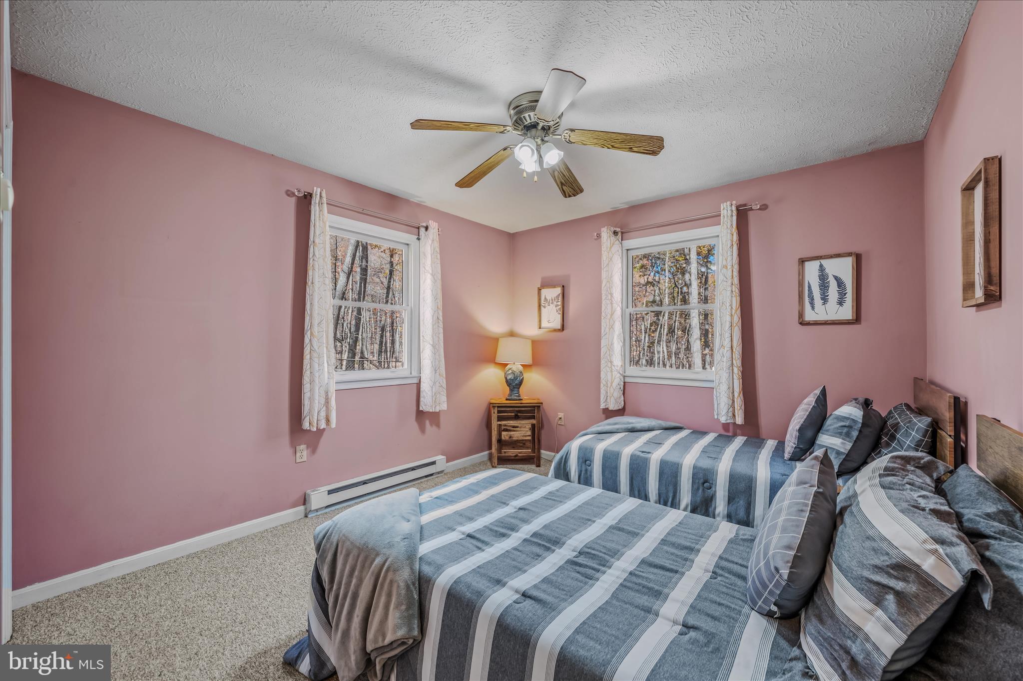 67 Tranquil Way Berkeley Springs, WV 25411 - Photo 19 of 37 a bedroom with a bed and window
