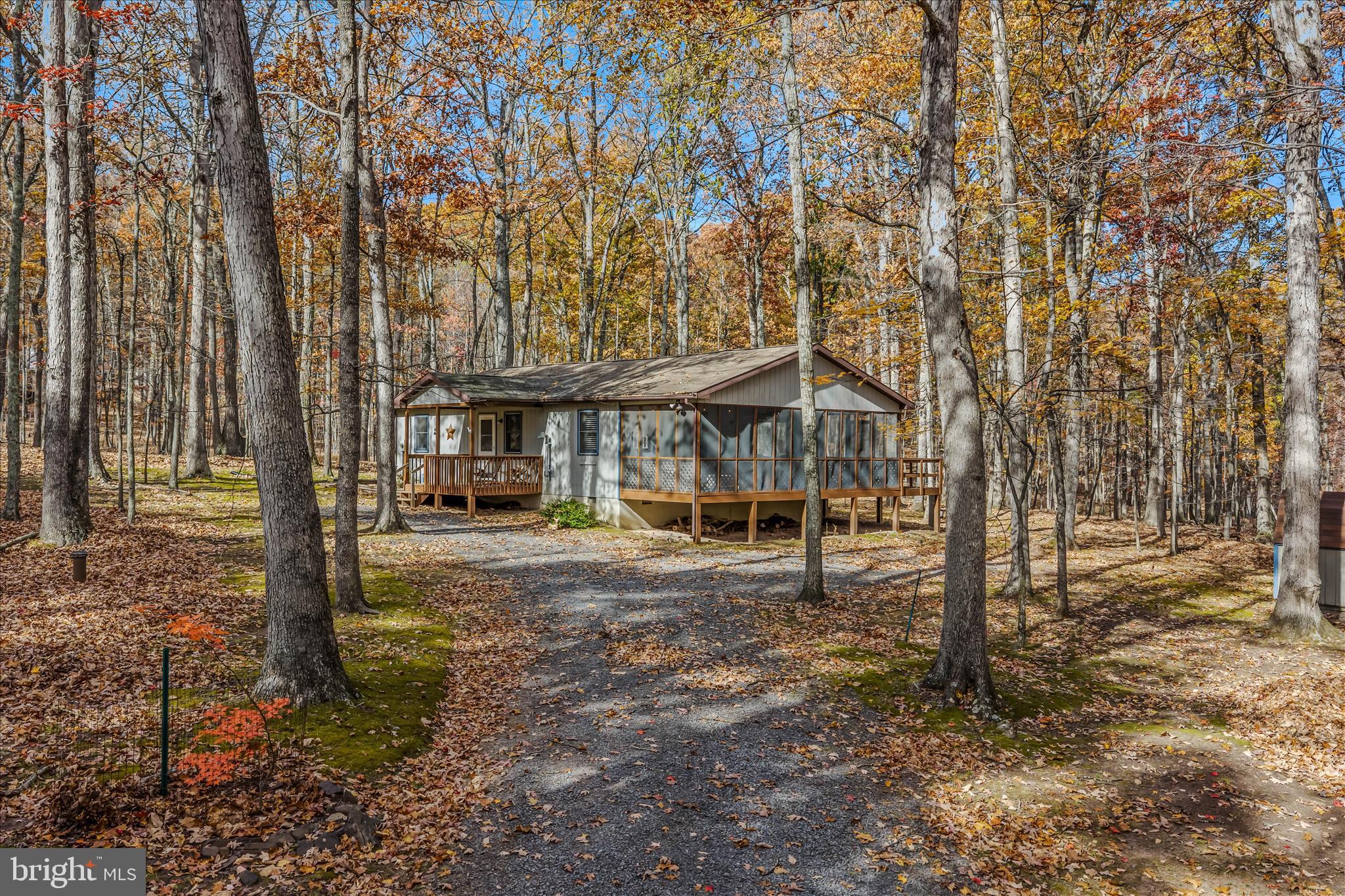 67 Tranquil Way Berkeley Springs, WV 25411 - Photo 2 of 37 a front view of a house with a yard