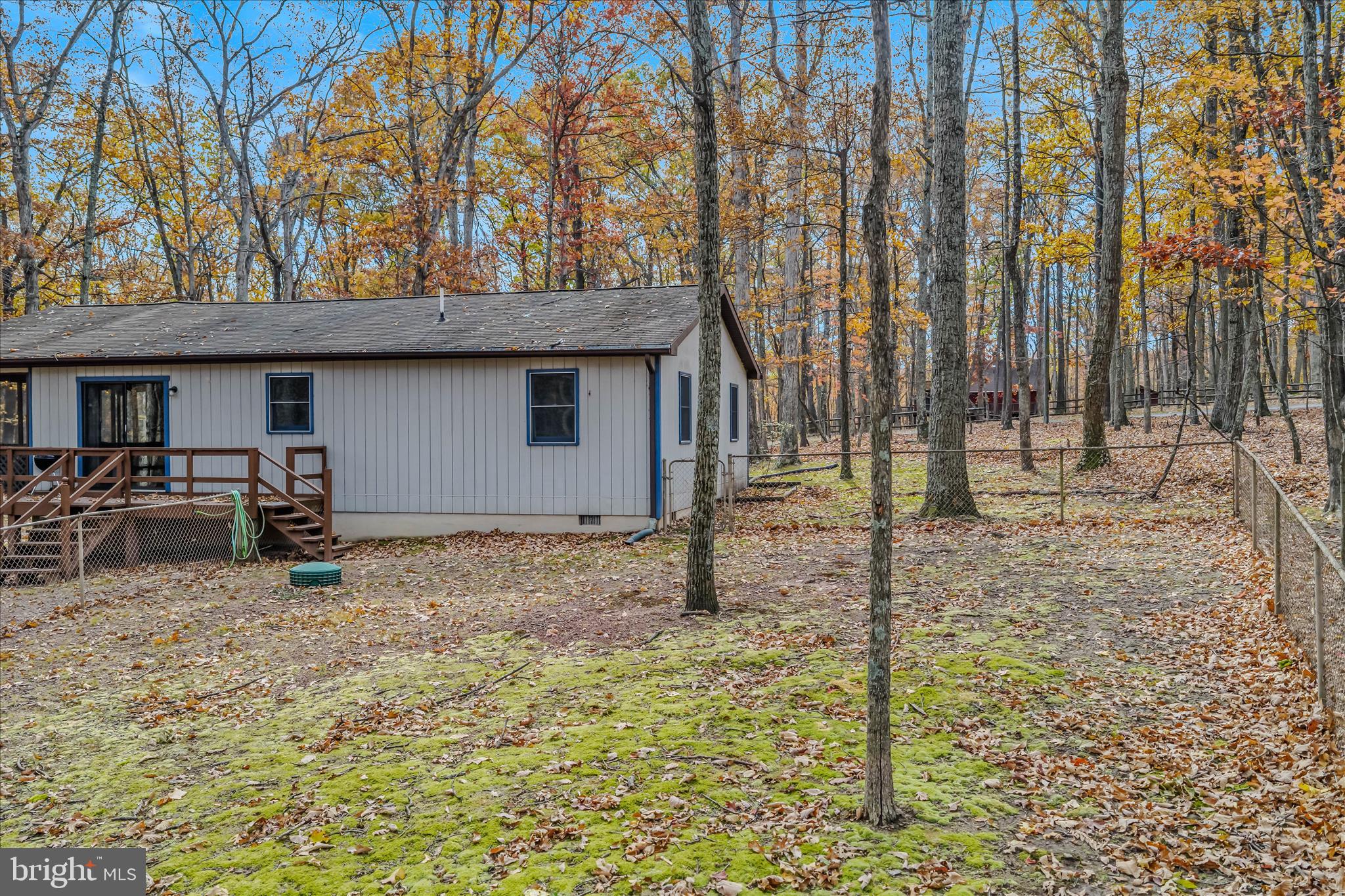 67 Tranquil Way Berkeley Springs, WV 25411 - Photo 24 of 37 a backyard of a house with table and chairs