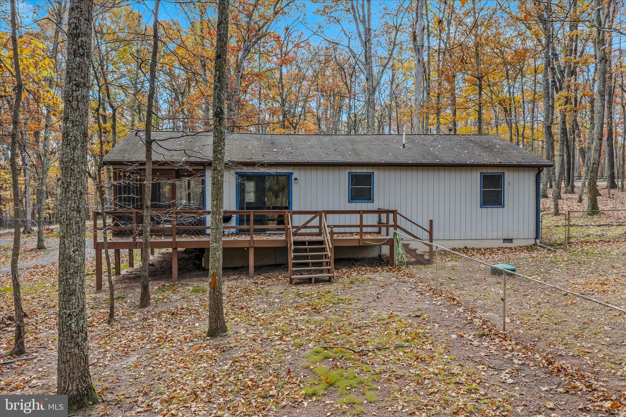 67 Tranquil Way Berkeley Springs, WV 25411 - Photo 26 of 37 a wooden bench sitting in front of a building
