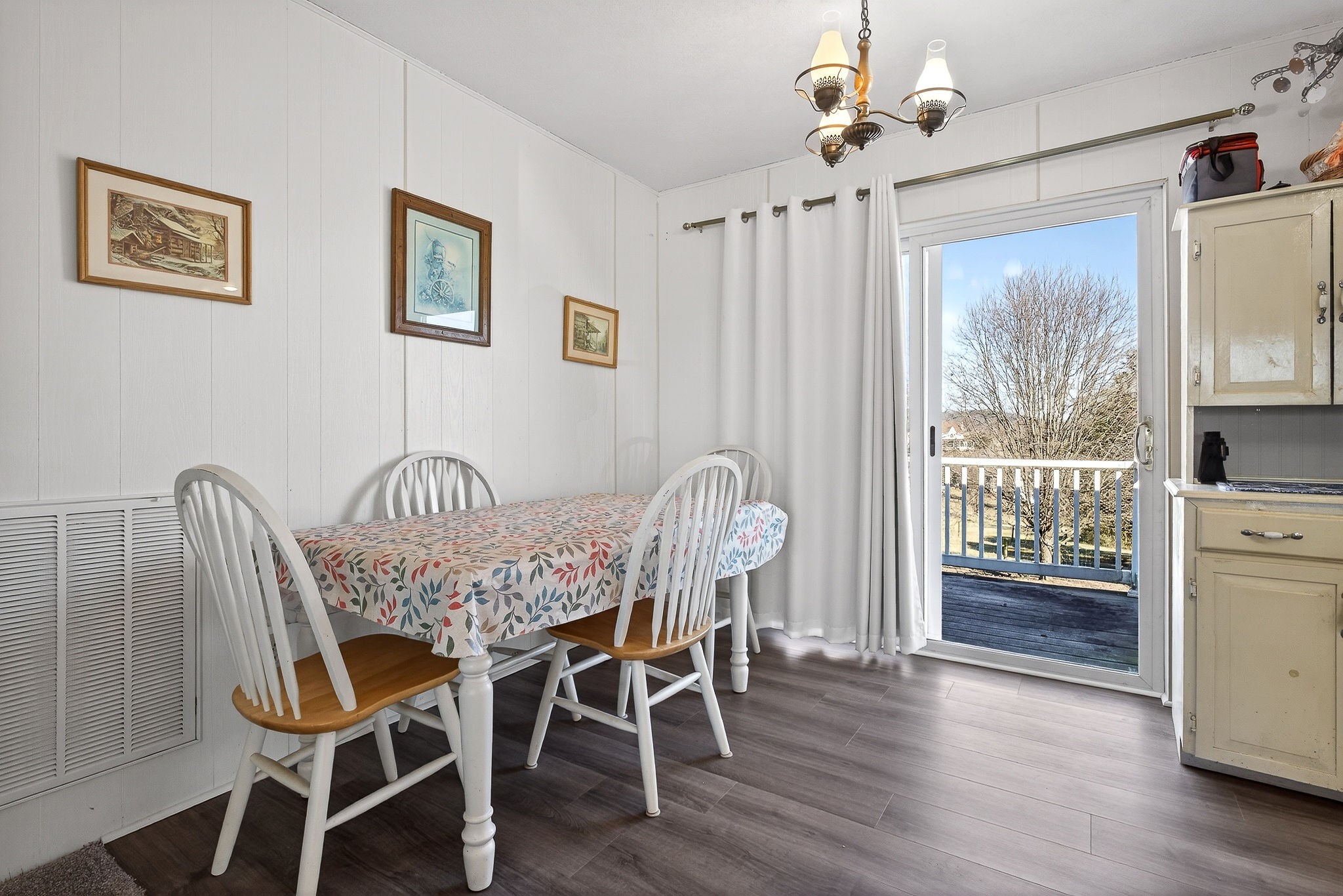 566 Turntable Road Sparta, TN 38583 - Photo 13 of 48 a view of a dining room with furniture window and wooden floor